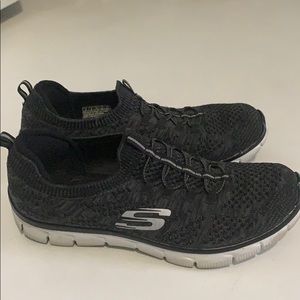 Skechers black slip on sneakers